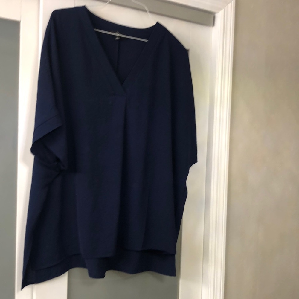 Blue shirt sleeve 100% polyester blouse.